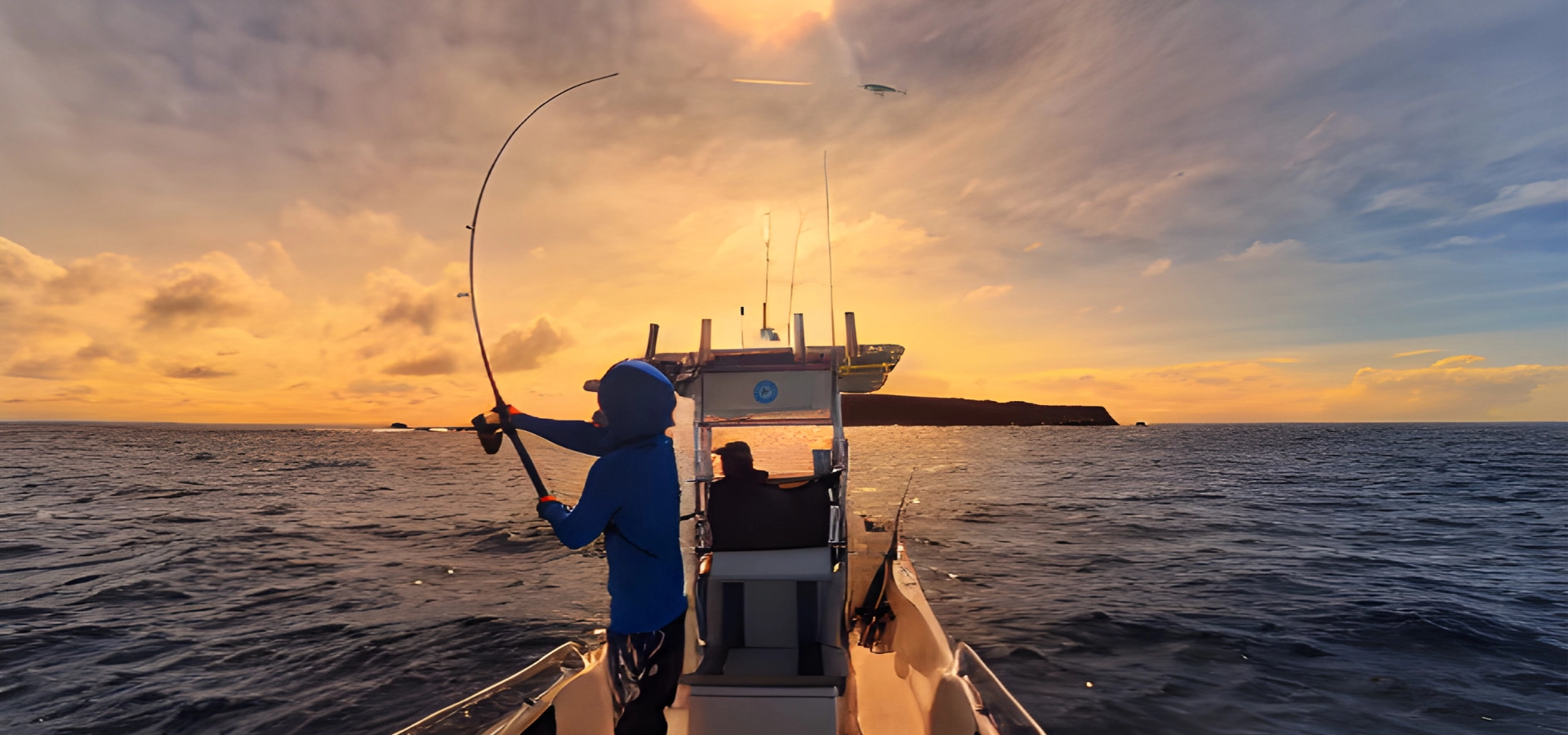 Angler casting handmade timber topwater lure from the boat at sunrise. 